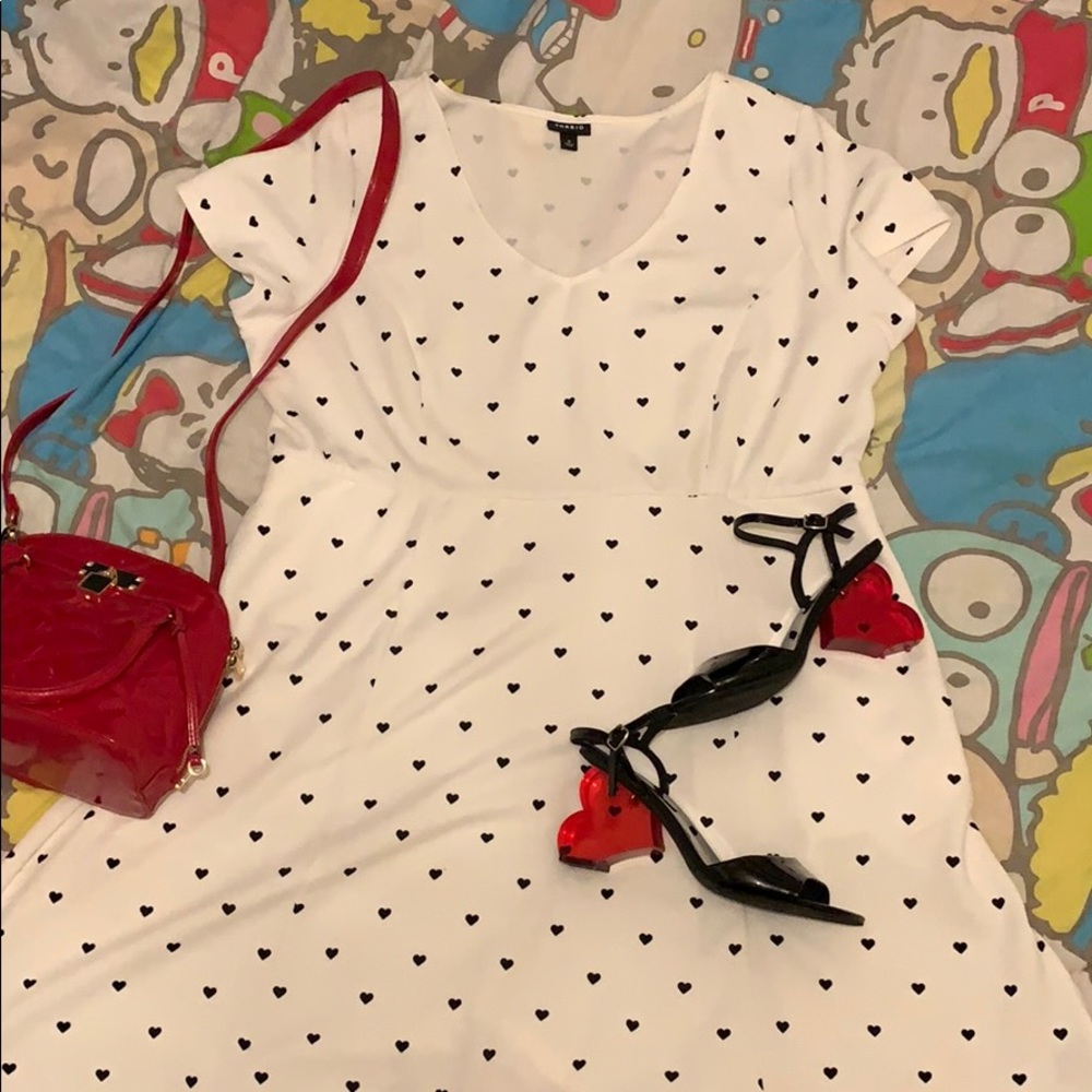 White dress with black hearts.